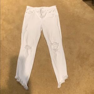 Size 28 distressed fringe bottom jeans